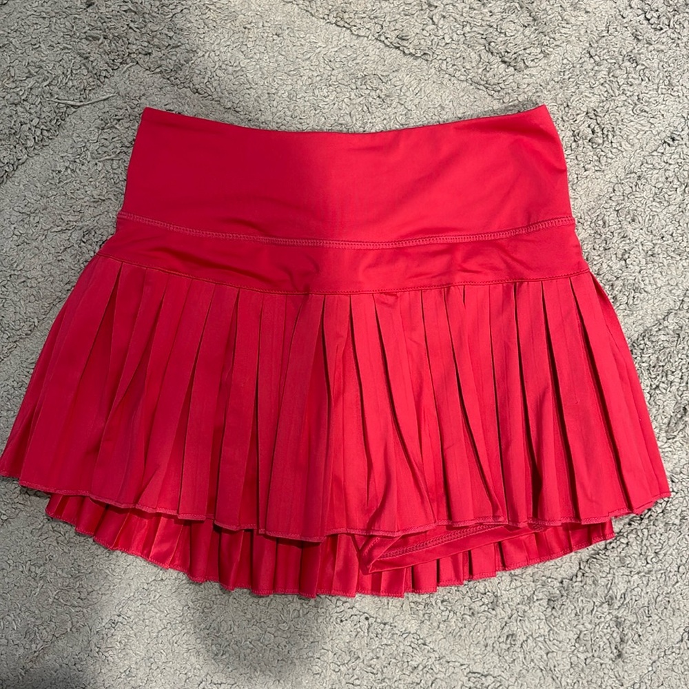 Bright pink GoldHinge tennis skirt